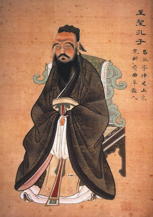a traditional Chinese painting of Confucius in a long robe with a black beard sitting on a traditional style chair
