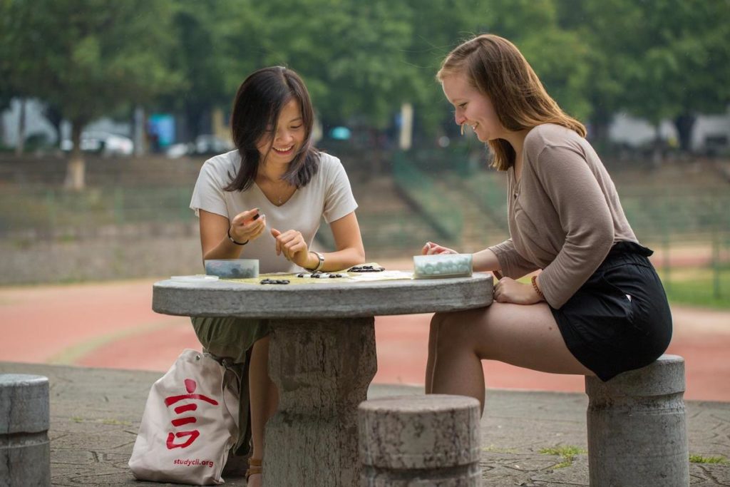 A CLI student and her teacher play a game of go, also known as weiqi