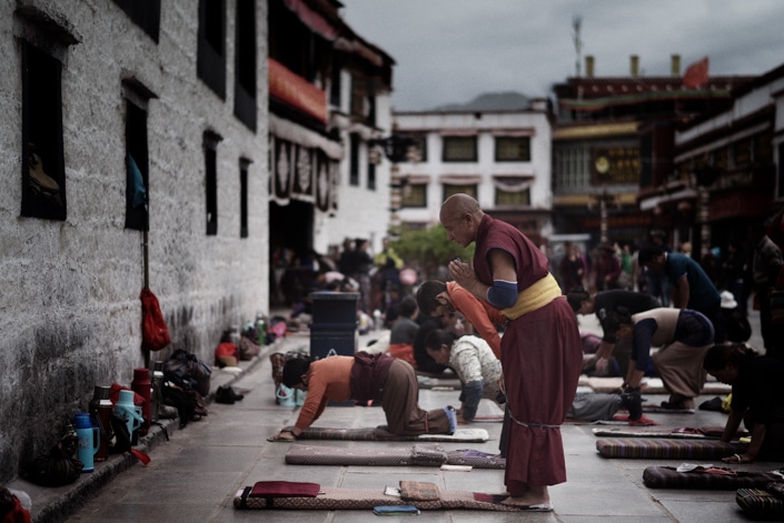 a Tibetan monk prayer at a temple