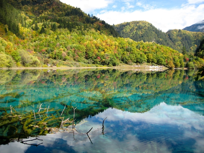 mountains reflected on water in Jiuzhaigou, one of the best places to visit in China