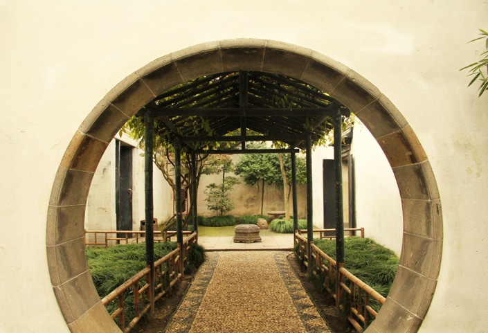 a round door in a traditional Chinese garden in Suzhou, one of the best places to visit in China