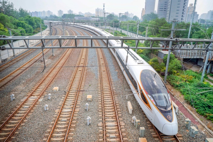 a Chinese fast train and five other train tracks