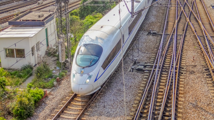 a Chinese fast train and several train tracks