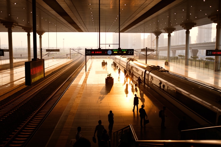 a Chinese train platform at dusk