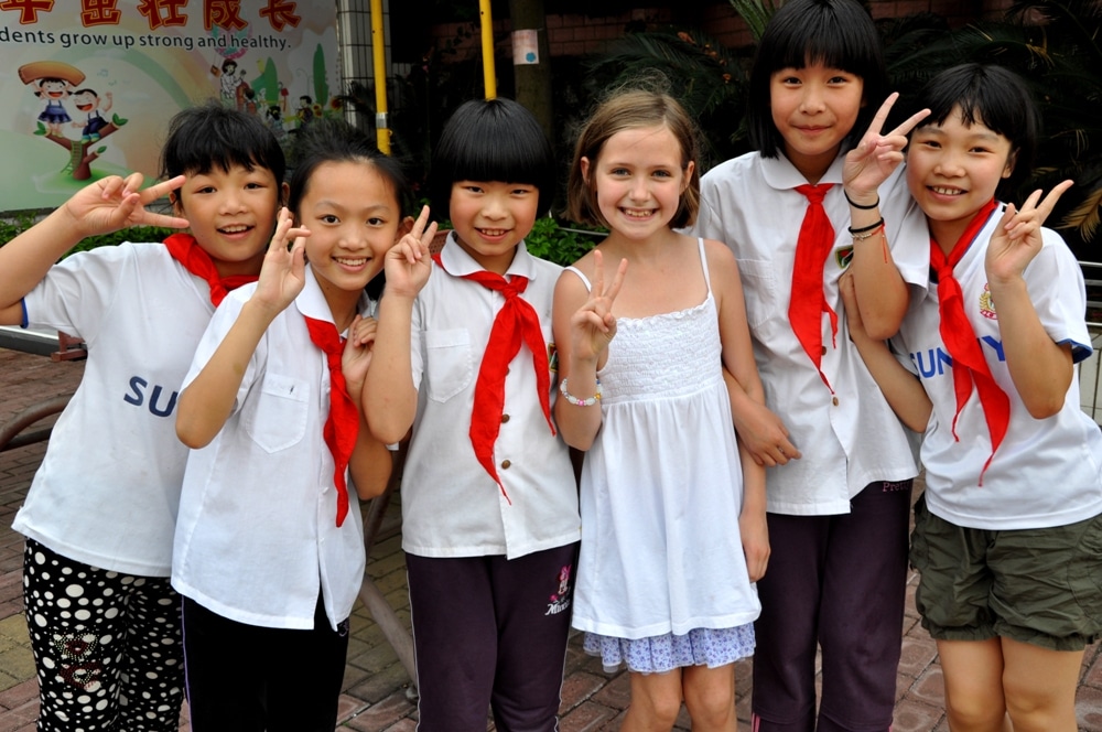 a group of Chinese elementary school students with a western child