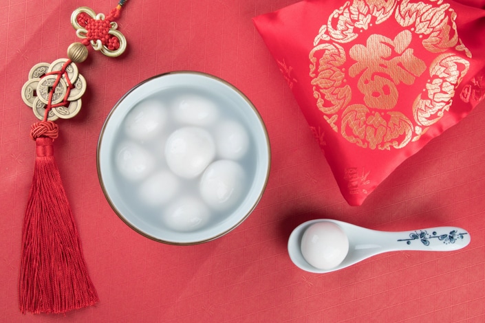 a bowl of Lantern Festival tangyuan on a red tablecloth