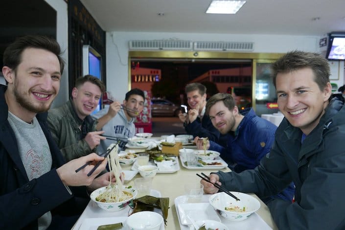 a group of CLI students enjoying Guilin rice noodles at a local restaurant 