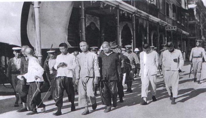 a black and white photograph of members of the Chinese communist party who were arrested by the Kuomintang in 1927