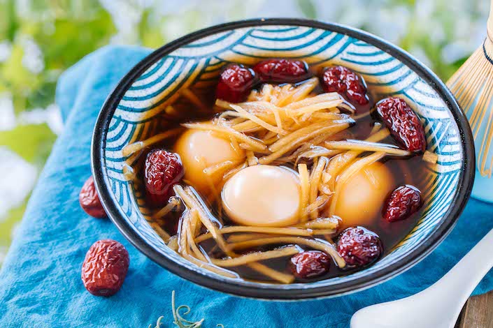 bowl of chinese hard boiled eggs in sweet broth