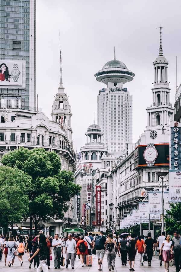 pedestrians walking on East Nanjing Road in Shanghai